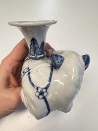 Two Chinese blue and white recumbent elephant-form candlesticks, Jiaqing