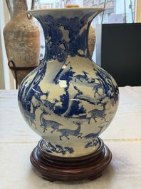A Chinese blue and white '100 Deers' 'Zun' vase on wooden stand, Kangxi mark, 19th C.