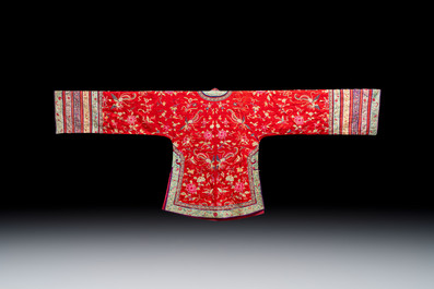 A Chinese embroidered silk red-ground women's robe, 19th C.