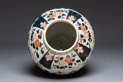 A large Japanese Imari baluster vase with floral relief design, Edo, ca. 1700