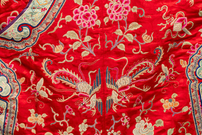 A Chinese embroidered silk red-ground women's robe, 19th C.