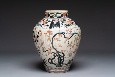 A large Japanese Imari baluster vase with floral relief design, Edo, ca. 1700