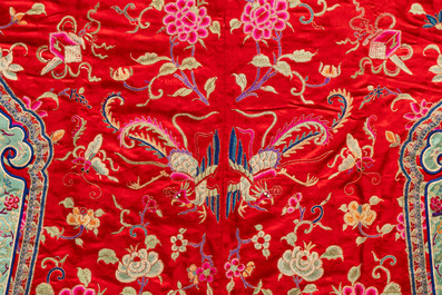 A Chinese embroidered silk red-ground women's robe, 19th C.