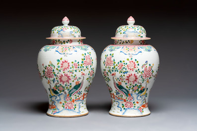 A pair of Chinese famille rose 'Phoenixes among Flowering Branches' vases and covers, 20th C.