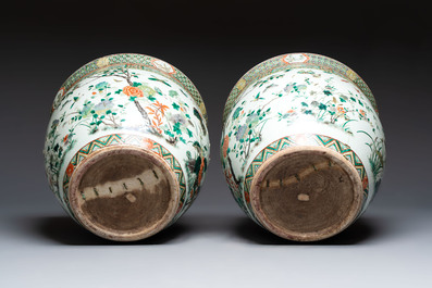 A pair of Chinese famille verte 'Flowers and Butterflies' fishbowls, 19th C.