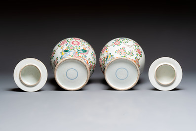 A pair of Chinese famille rose 'Phoenixes among Flowering Branches' vases and covers, 20th C.