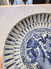 Four Chinese 'Kraak' blue and white plates with a bird on a rock, Wanli