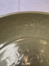 A rare and large Chinese Longquan celadon dish with floral design, Ming, early 15th C.