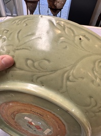 A rare and large Chinese Longquan celadon dish with floral design, Ming, early 15th C.
