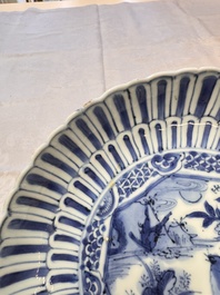 Four Chinese 'Kraak' blue and white plates with a bird on a rock, Wanli