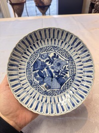 Four Chinese 'Kraak' blue and white plates with a bird on a rock, Wanli