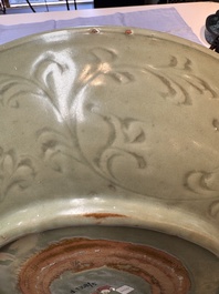 A rare and large Chinese Longquan celadon dish with floral design, Ming, early 15th C.