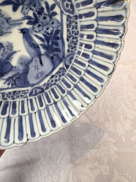 Four Chinese 'Kraak' blue and white plates with a bird on a rock, Wanli