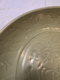 A rare and large Chinese Longquan celadon dish with floral design, Ming, early 15th C.