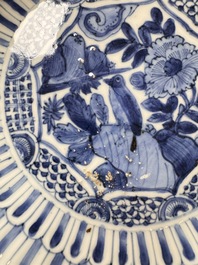 Four Chinese 'Kraak' blue and white plates with a bird on a rock, Wanli