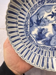 Four Chinese 'Kraak' blue and white plates with a bird on a rock, Wanli