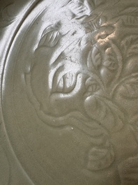 A rare and large Chinese Longquan celadon dish with floral design, Ming, early 15th C.