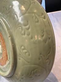 A rare and large Chinese Longquan celadon dish with floral design, Ming, early 15th C.