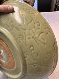 A rare and large Chinese Longquan celadon dish with floral design, Ming, early 15th C.