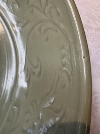 A rare and large Chinese Longquan celadon dish with floral design, Ming, early 15th C.