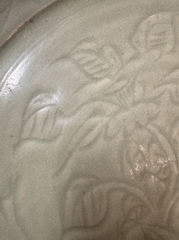 A rare and large Chinese Longquan celadon dish with floral design, Ming, early 15th C.