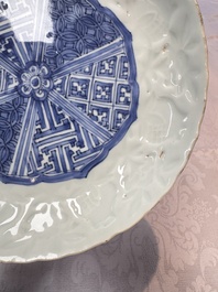 A fine Chinese blue and white moulded Kraak porcelain dish with incised 'Pomegranates' rim, Wanli