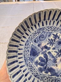 Four Chinese 'Kraak' blue and white plates with a bird on a rock, Wanli