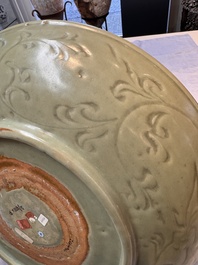 A rare and large Chinese Longquan celadon dish with floral design, Ming, early 15th C.