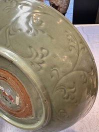 A rare and large Chinese Longquan celadon dish with floral design, Ming, early 15th C.