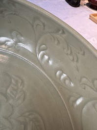 A rare and large Chinese Longquan celadon dish with floral design, Ming, early 15th C.