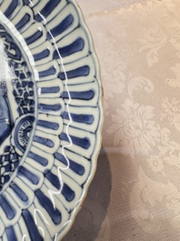 Four Chinese 'Kraak' blue and white plates with a bird on a rock, Wanli