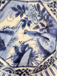 Four Chinese 'Kraak' blue and white plates with a bird on a rock, Wanli