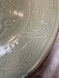 A rare and large Chinese Longquan celadon dish with floral design, Ming, early 15th C.