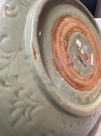 A rare and large Chinese Longquan celadon dish with floral design, Ming, early 15th C.
