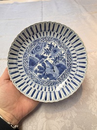 Four Chinese 'Kraak' blue and white plates with a bird on a rock, Wanli