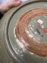 A rare and large Chinese Longquan celadon dish with floral design, Ming, early 15th C.