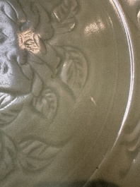 A rare and large Chinese Longquan celadon dish with floral design, Ming, early 15th C.
