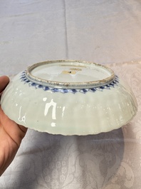 Four Chinese 'Kraak' blue and white plates with a bird on a rock, Wanli