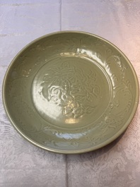 A rare and large Chinese Longquan celadon dish with floral design, Ming, early 15th C.
