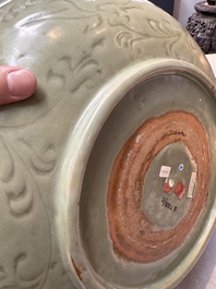 A rare and large Chinese Longquan celadon dish with floral design, Ming, early 15th C.