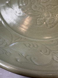 A rare and large Chinese Longquan celadon dish with floral design, Ming, early 15th C.