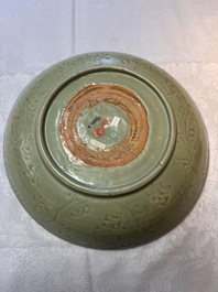 A rare and large Chinese Longquan celadon dish with floral design, Ming, early 15th C.