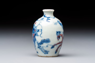 A Chinese blue, white and copper-red 'Romance of the Three Kingdoms' snuff bottle, Yongzheng mark, 19th C.
