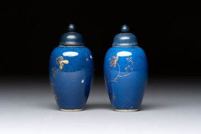 A pair of Chinese gilt-decorated powder-blue-ground miniature vases and wooden covers, 18th C.