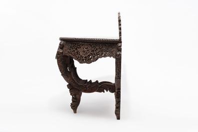 A finely carved Anglo-Indian rosewood demi-lune console table with lions, 19th C.