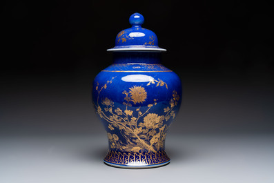 A Chinese gilt-decorated powder-blue-ground vase and cover, Kangxi mark, 19th C.
