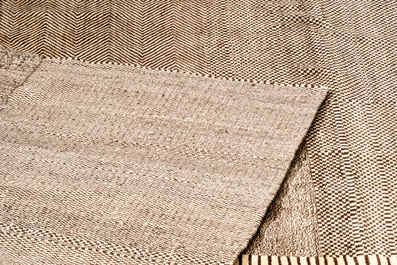 A very large Persian hand-knotted wool carpet with a geometric patchwork design, 20th C.