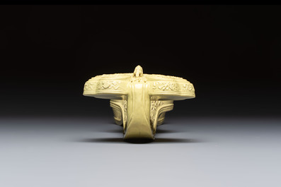A large Chinese lemon-yellow-glazed biscuit 'Dragons' ruyi in the style of Wang Bingrong, on a wooden stand, Republic