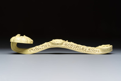 A large Chinese lemon-yellow-glazed biscuit 'Dragons' ruyi in the style of Wang Bingrong, on a wooden stand, Republic