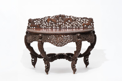 A finely carved Anglo-Indian rosewood demi-lune console table with lions, 19th C.